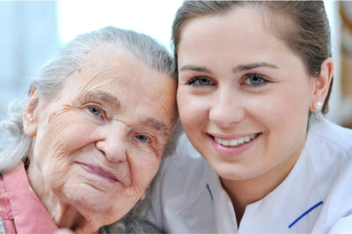 female and elderly woman smiling