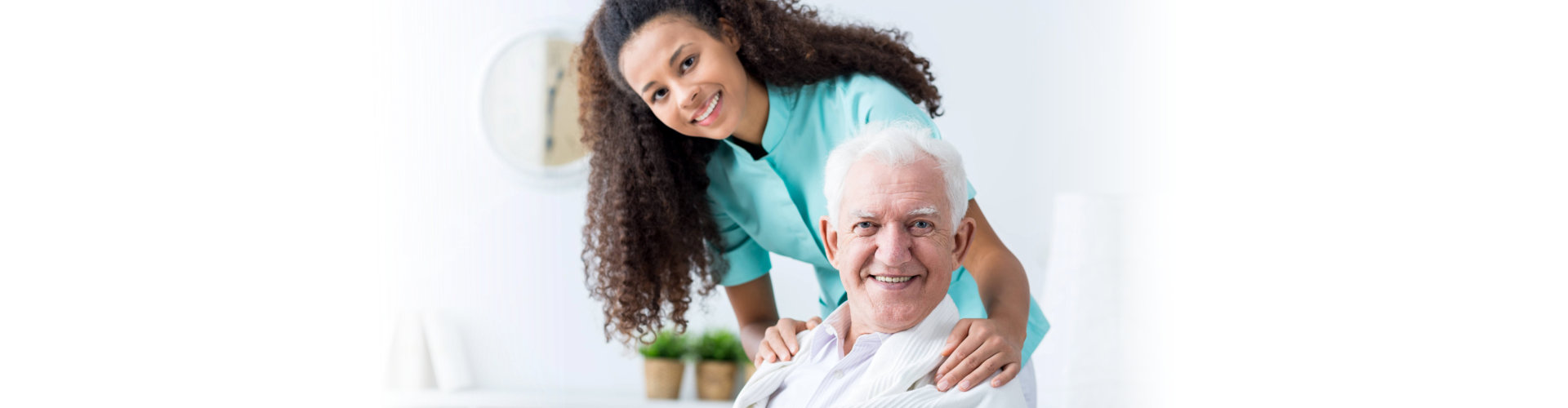 female nurse and elderly man smiling